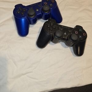 Sony DualShock Controllers - Black and Blue